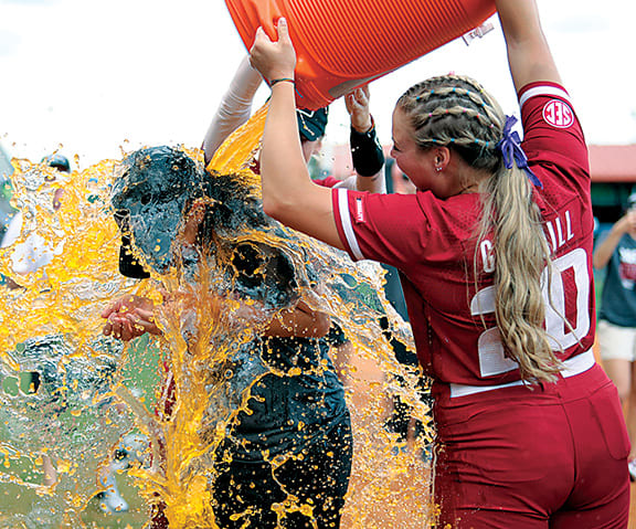 Arkansas Razorback softball coach Courtney Deifel gets bathed in Gatorade during her postgame interview with ESPN following the team's 4-0 shutout of Missouri in the SEC tournament championship game at Florida. It was the Razorbacks' first appearance in the championship this century and the team's first ever tournament title.